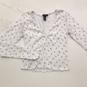 Cropped long sleeve floral top